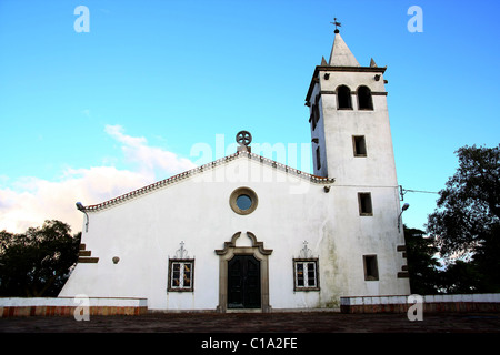 Full frontal view of a small christian church on the village of Barranco do Velho in Algarve, Portugal. Stock Photo