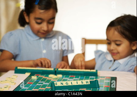 Kids playing scrabble game Stock Photo