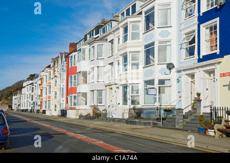 Row of colourful homes houses properties and guesthouses on the seafront Glandyfi Terrace Aberdovey Gwynedd Wales UK United Kingdom GB Great Britain Stock Photo