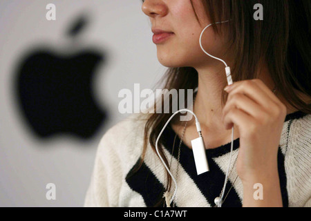 APPLE OF MY iPOD If you didn't think iPods could get any smaller - think again! Apple have devised their smallest MP3 player Stock Photo