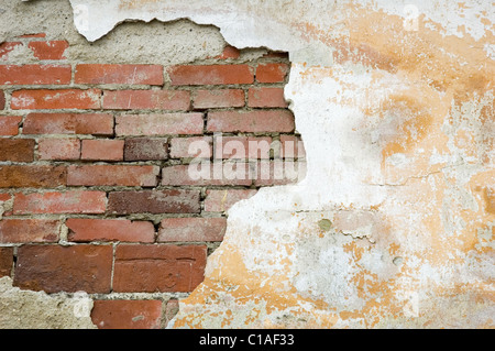 Break on the white wall - old brickwork Stock Photo