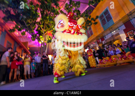 Lion dance performers during Chinese New Year.  Clarke Quay, Singapore Stock Photo