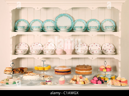 VINTAGE CHINA TEACUPS WITH CAKES Stock Photo