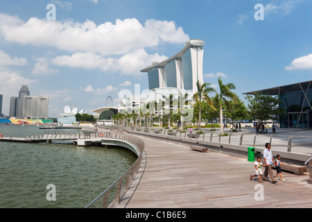 View along waterfront to Marina Bay Sands Singapore.  Marina Bay, Singapore Stock Photo