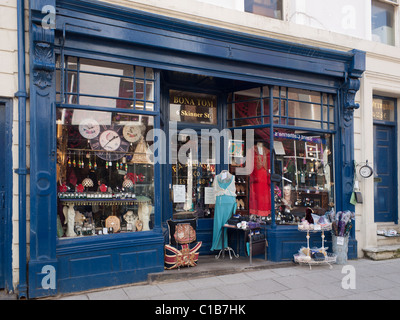 An antique and curio shop with elegant clothing on dressmakers dummies Stock Photo