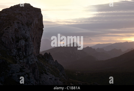 Mountain range view with medieval watchtower near Cap de Formentor, Tramuntana mountain range, Mallorca, Balearic Islands, Spain Stock Photo