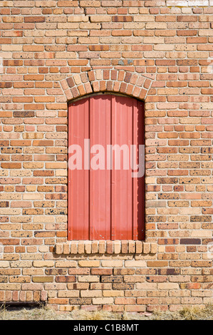 Brick wall and arch window on an abandoned building in Claunch, New Mexico. Stock Photo