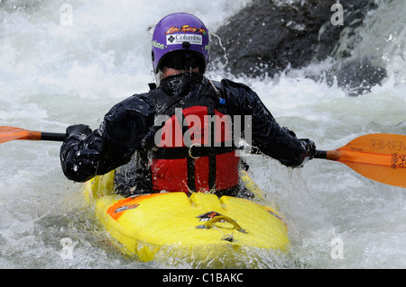 A young man kayaking in a river in Leon, Spain. Stock Photo