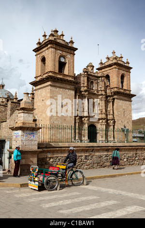 Tricycle taxi in front of San Francisco de Asís church, Plaza de Armas, Ayaviri, Puno Department, Peru Stock Photo