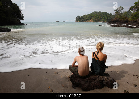 A young couple on the beach, Manuel Antonio national park in Costa Rica Stock Photo