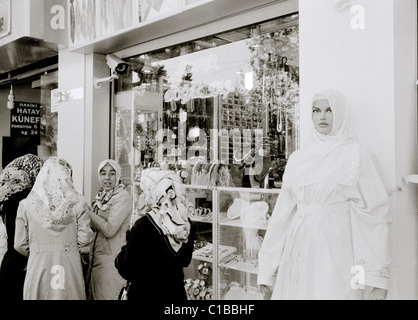 Conservative Islamic women in Eyup Istanbul in Turkey in Middle East Asia. Headscarf Culture Reportage Street Scene Woman Muslim Urban Travel Stock Photo