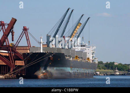 Big dry cargo ship at pier in Harbor Stock Photo