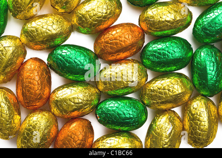 colorful chocolate eggs on white background Stock Photo