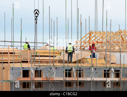 building contractors at work on housing on a construction site, cornwall, uk Stock Photo