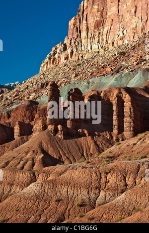 USA, Utah, Capitol Reef NP. Colorful sandstone cliffs rise above the Scenic Drive. Stock Photo