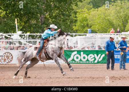 Cowgirl riding fast during barrel racing, Strathmore Heritage Days, Rodeo, Strathmore, Alberta, Canada Stock Photo