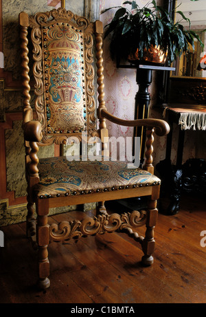 Norway, Sogn, Utne (Hardangerfjord), Utne hotel, armchair in carved wood Stock Photo