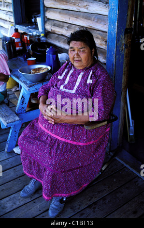 Canada Quebec Province La Verendrye Wildlife Reserve Lake Victoria village of Big Lake Victoria Algonquian woman on her porch Stock Photo