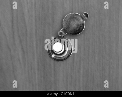 Photo of a peephole on an apartment door. Stock Photo