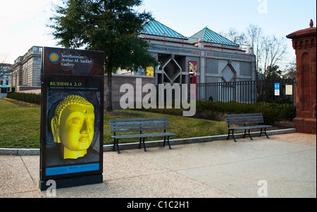Washington DC, The Smithsonian Arthur M. Sackler Gallery and Museum with a sign in front showing a picture of Buddha art. Stock Photo