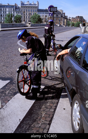 France, Paris, Police officers on bikes making controls