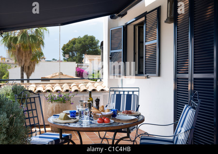 Table set for lunch on veranda of Italian country villa Stock Photo - Alamy