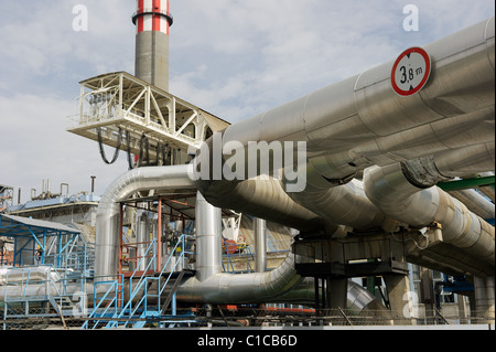 Pipes and tubes and chimney at a powerplant Stock Photo