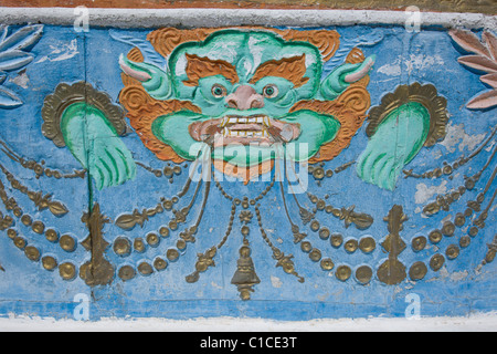 Detail of Buddhist demon relief on the Shanti Stupa, Leh, (Ladakh) Jammu & Kashmir, India Stock Photo