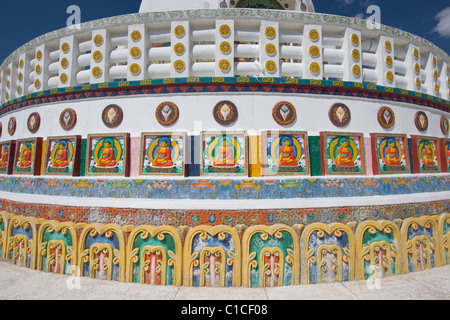 Detail of Buddhist reliefs, including Buddha images, on the Shanti Stupa, Leh, (Ladakh) Jammu & Kashmir, India Stock Photo