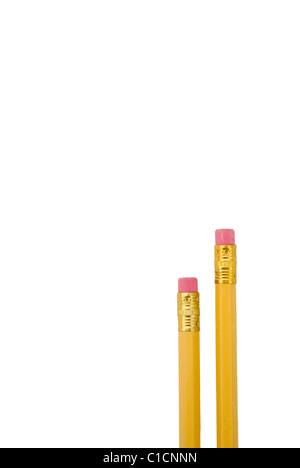 Two yellow pencils with erasers at the ends isolated on white background Stock Photo