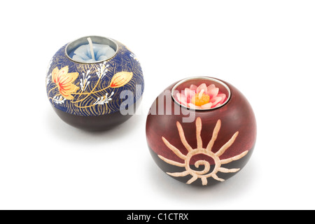 Two candlesticks, wooden balls with candle on white background Stock Photo