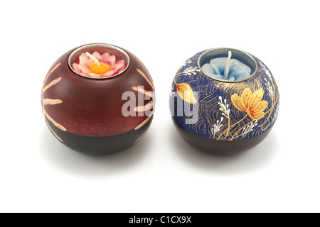 Two candlesticks, wooden balls with candle on white background Stock Photo
