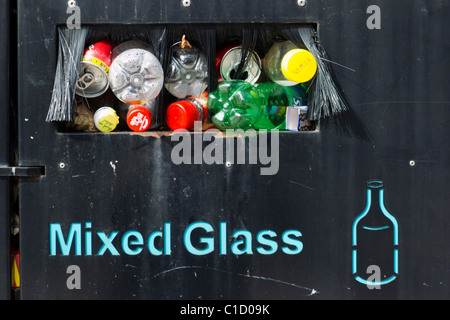 Public recycling container bin full of bottles cans and glass Stock Photo