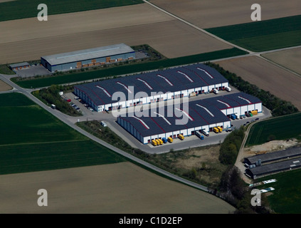 aerial view above warehouse roof covered with solar panels Bavaria Germany Stock Photo