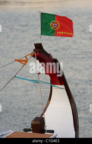 Portugal flag in the background of water attached to the bow of the boat. Portimao, Algarve, PORTUGAL Stock Photo