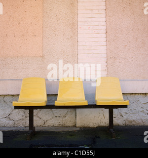 Three seats in a station Stock Photo