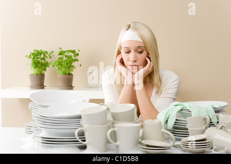 Modern kitchen - frustrated woman in kitchen, fed up Stock Photo