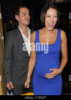 Matt Willis and his wife Emma Griffiths, who is sporting a rather large baby bump, spend the evening at the Dorchester Hotel Stock Photo