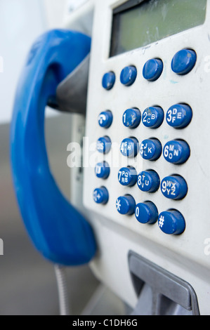 Public pay phone close up with selective focus on keypad Stock Photo