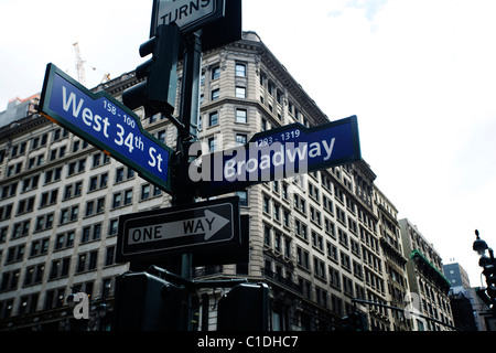 Road signs indicating West 34th Street and Broadway junction in Manhattan, New York USA Stock Photo