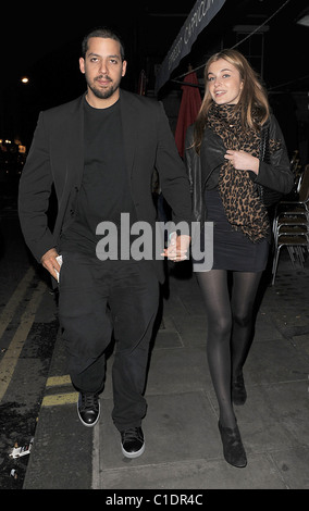 American magician David Blaine walking through Soho with his girlfriend. A beggar accosted the couple and asked for some spare Stock Photo