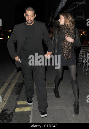 American magician David Blaine walking through Soho with his girlfriend. A beggar accosted the couple and asked for some spare Stock Photo