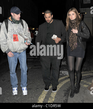 American magician David Blaine walking through Soho with his girlfriend. A beggar accosted the couple and asked for some spare Stock Photo