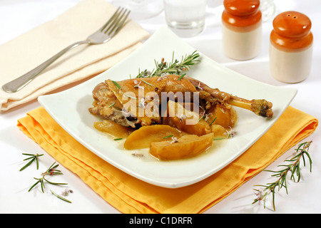 Roasted chicken with apples and rosemary. Recipe available. Stock Photo