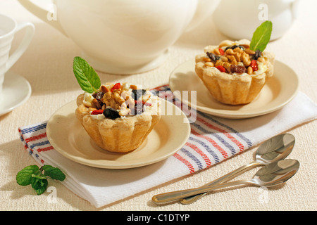 Tartlets with cheese and nuts. Recipe available. Stock Photo