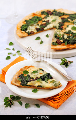 Wholemeal pizza with spinach. Recipe available. Stock Photo