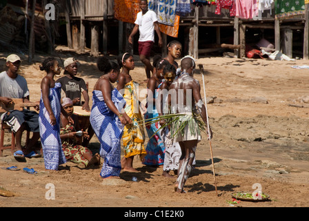 Madagascar, Island of Nosy Komba (next to Nosy Be) fishing village of Ampangoriana. Local villagers in typical attire. Stock Photo