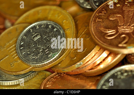 A pile of British coins, pennies, two pence's, five pence's and ten pence's. Stock Photo