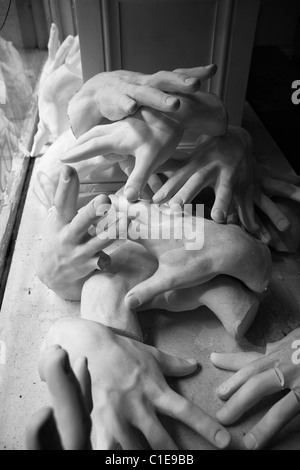 Plaster hands in the window of a business that makes mannequins and other models in the garment district in New York City. Stock Photo