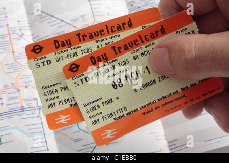 Off-Peak Day Travelcards with underground map in background Stock Photo